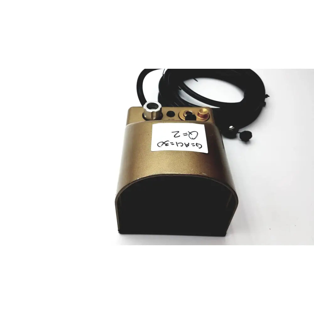 Gold-colored metal midas rex legend foot pedal with black rubber base and coiled cable for legend gold pneumatic drill control