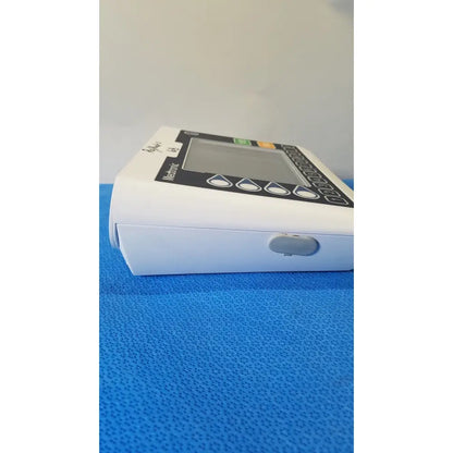 White plastic home blood pressure monitor with digital display and buttons from medtronic commander flex cd320-gv patient monitor
