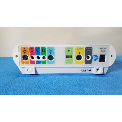 White medtronic commander flex patient monitor with colorful labeled ports usb port and cuff indicator on back side