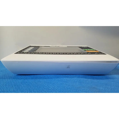 White medical infusion pump with digital display and numeric keypad from medtronic commander flex patient monitor