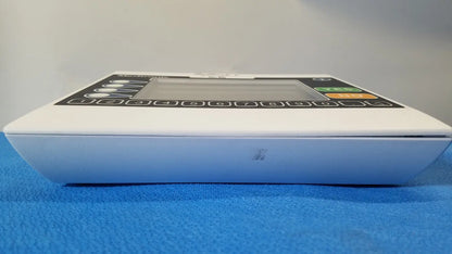 White medical infusion pump with digital display and numeric keypad from medtronic commander flex patient monitor