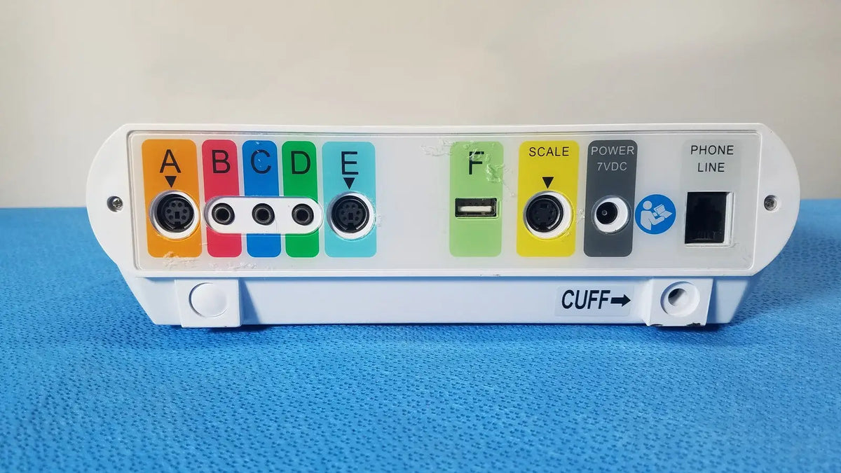 White medtronic commander flex patient monitor with colorful labeled ports usb port and cuff indicator on back side