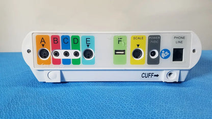 White medtronic commander flex patient monitor with colorful labeled ports usb port and cuff indicator on back side