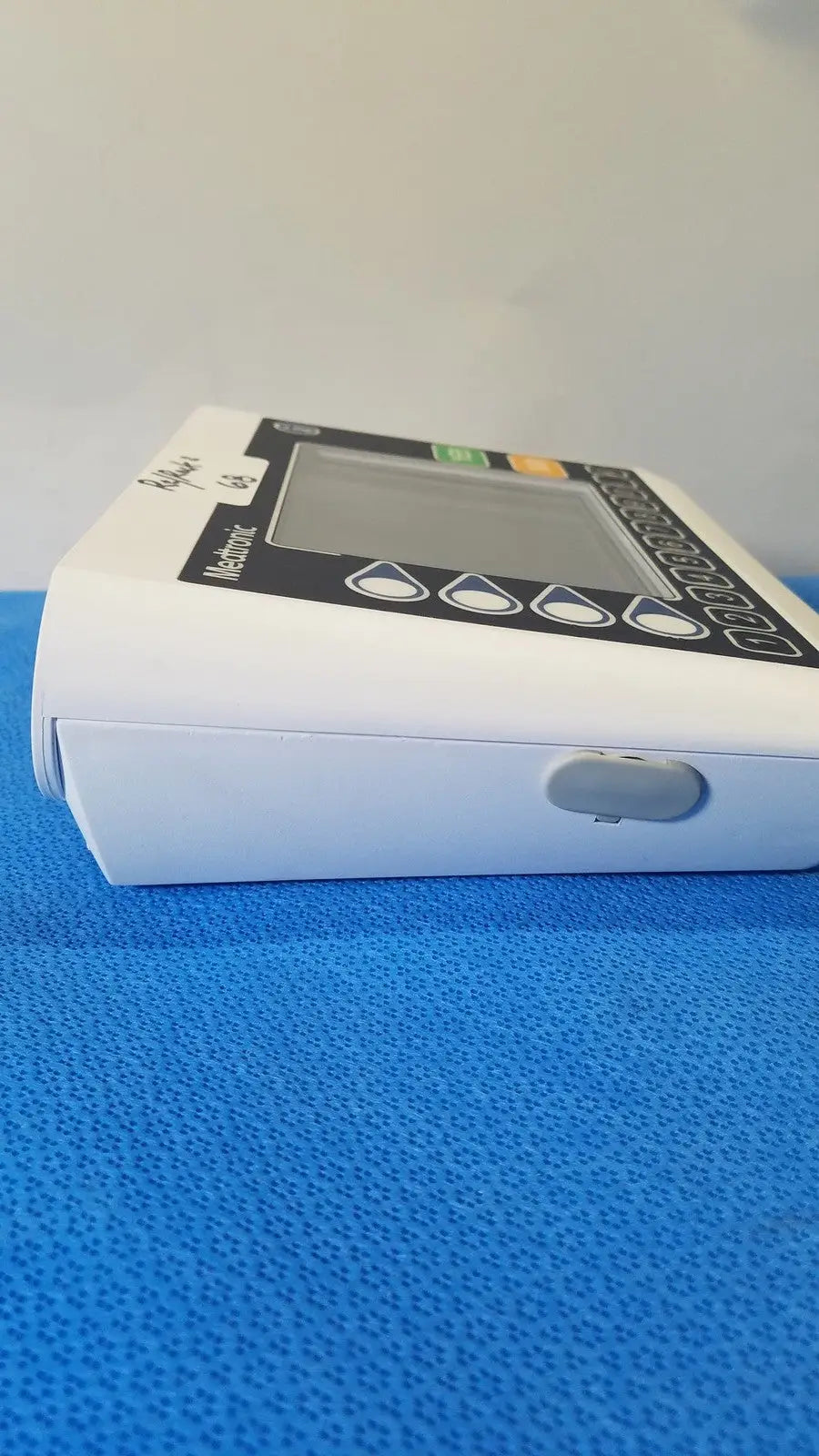 White plastic home blood pressure monitor with digital display and buttons from medtronic commander flex cd320-gv patient monitor