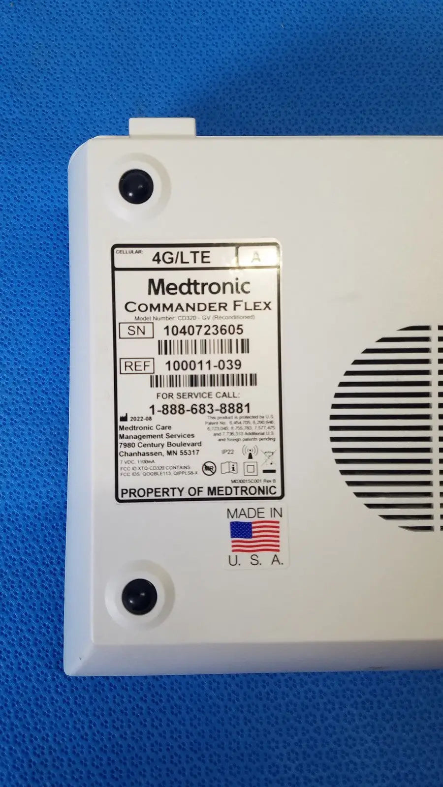 White plastic medtronic commander flex 4g lte medical device back with vented panel and service label for patient monitoring