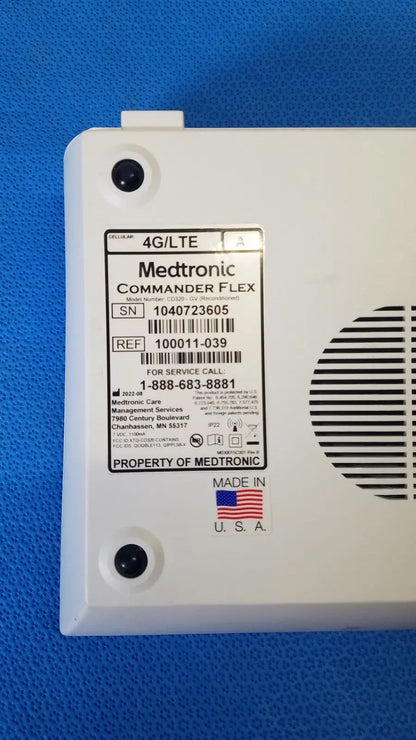 White plastic medtronic commander flex 4g lte medical device back with vented panel and service label for patient monitoring