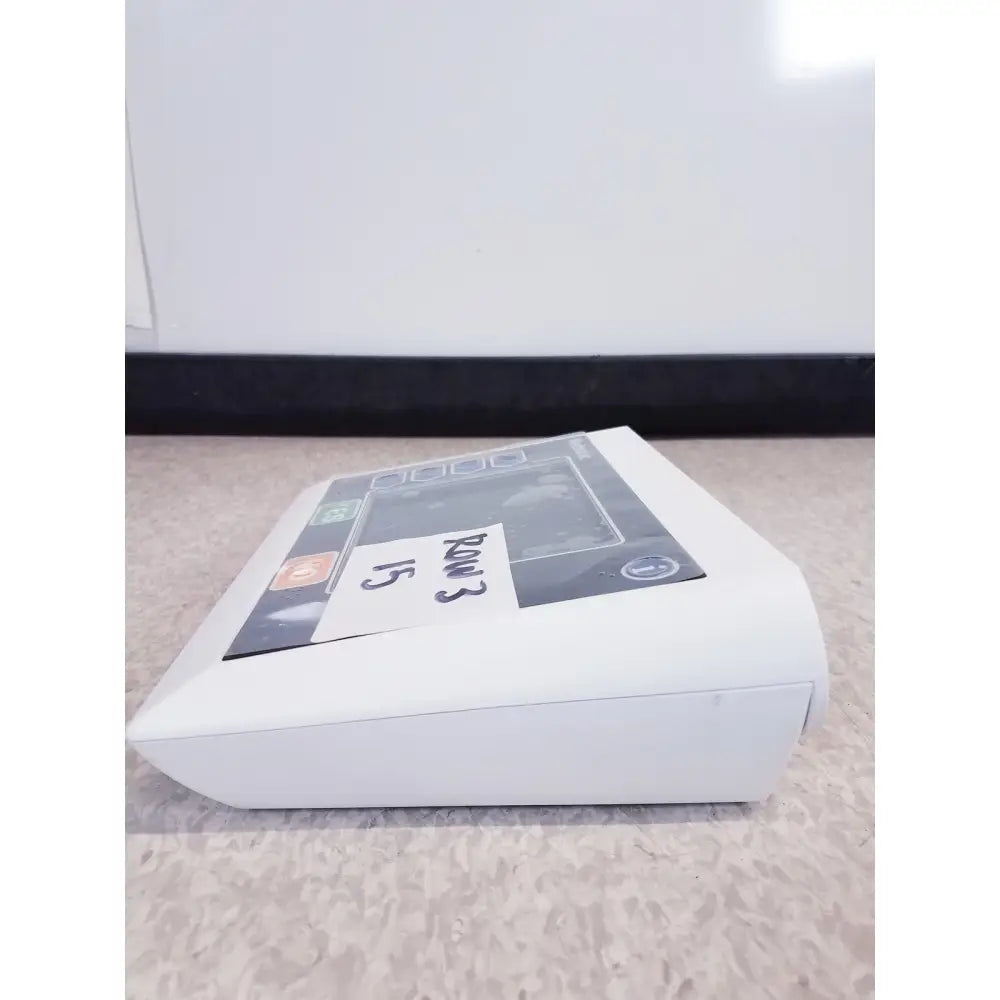 White rectangular electronic device with screen and buttons labeled rm3 15 featuring medtronic commander flex system cd315 untested