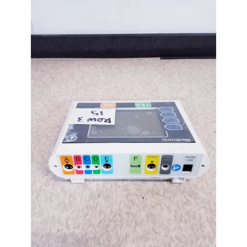 White medtronic commander flex system cd315 with gray touchscreen and colorful labeled ports showing back connectors for reuse medical use