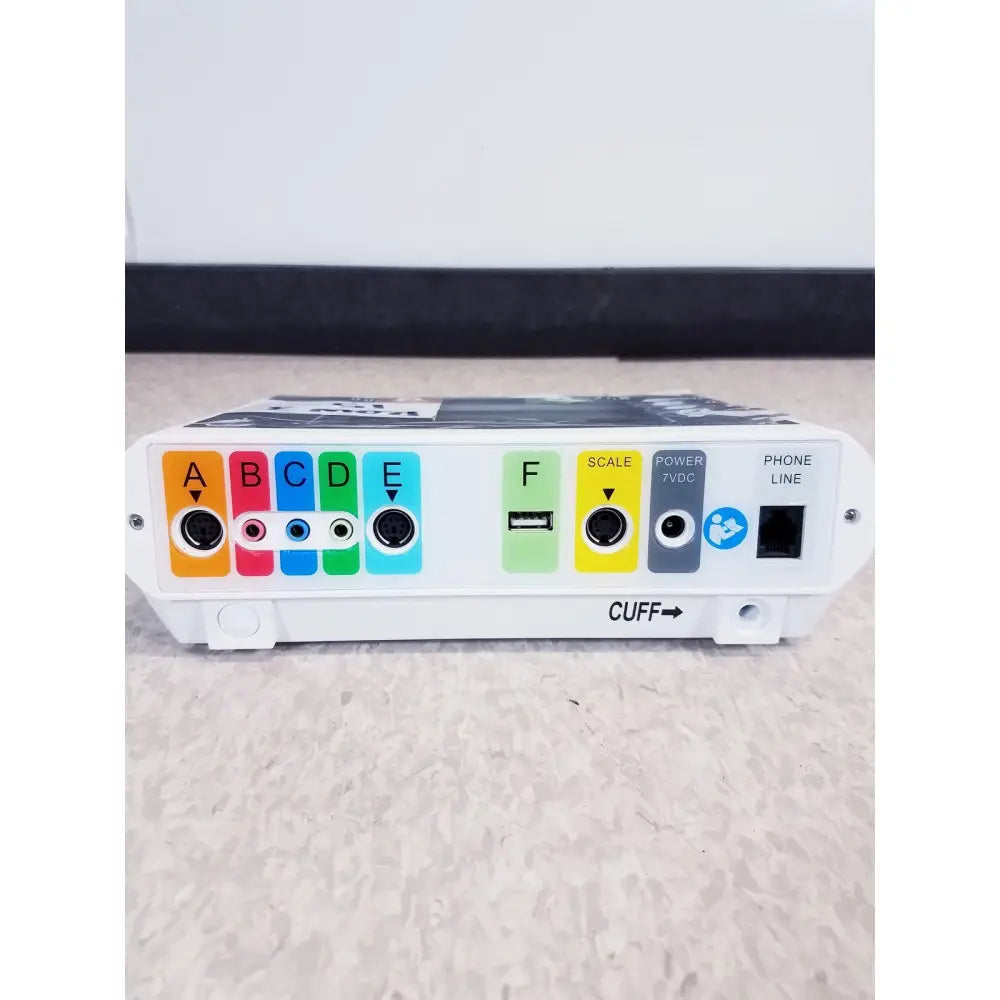 White medtronic commander flex system cd315 medical device with colorful labeled ports usb port and cuff indicator on side