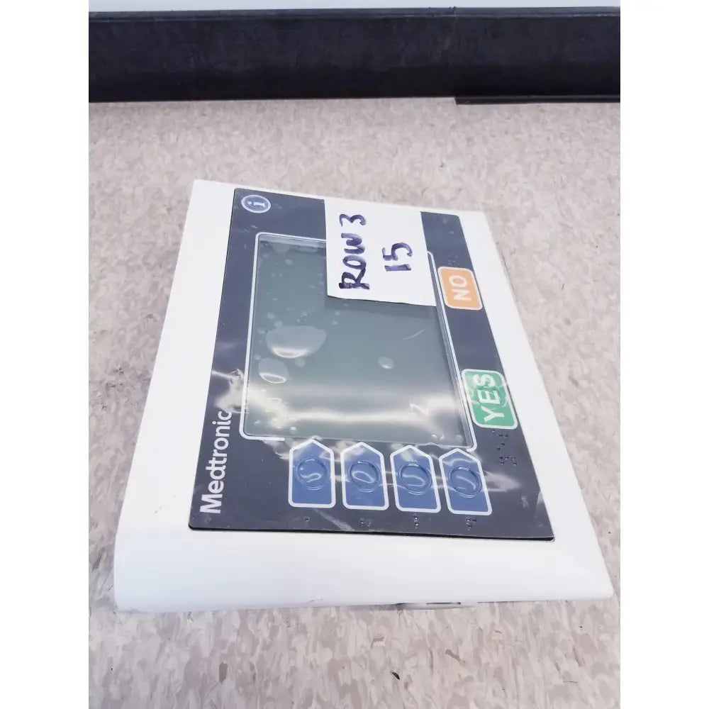 Medtronic commander flex system cd315 control panel with rectangular touchscreen and blue arrow buttons for reuse medical use