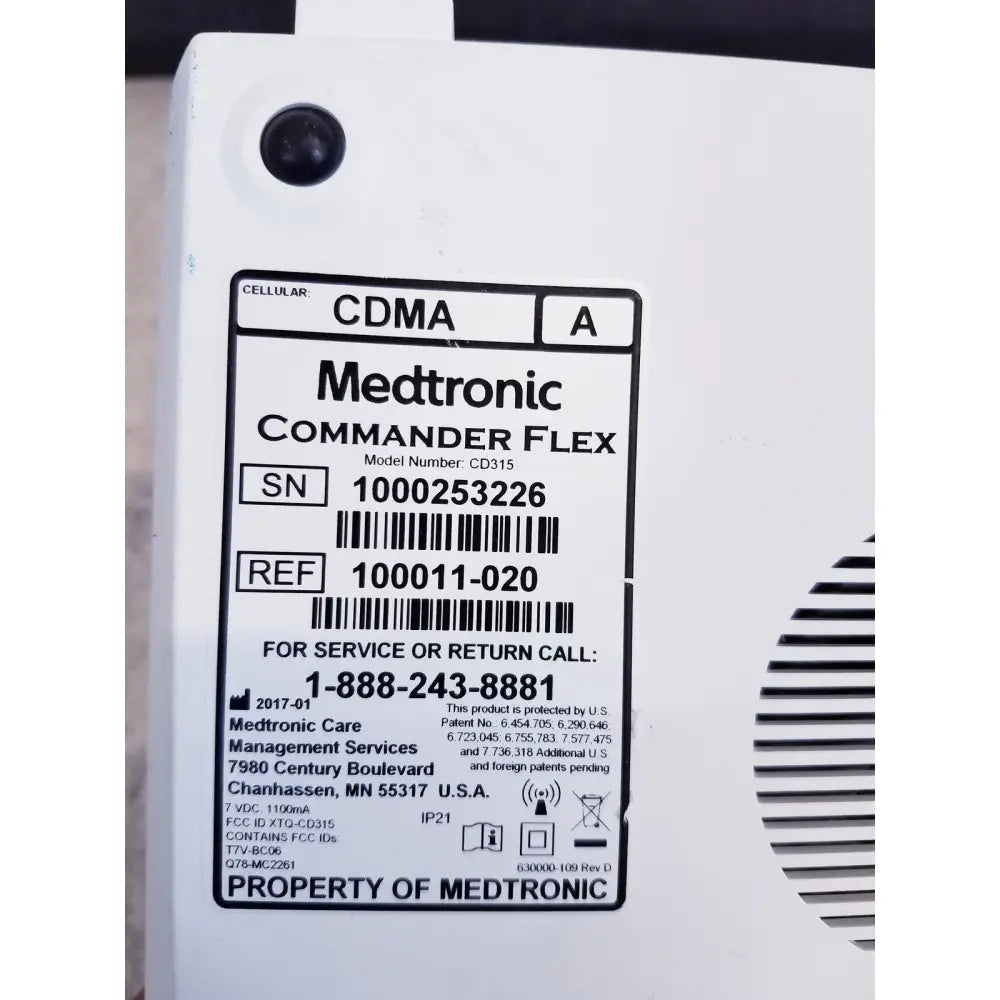White medtronic commander flex cd315 cellular device with black label showing model and service info for reuse medical use