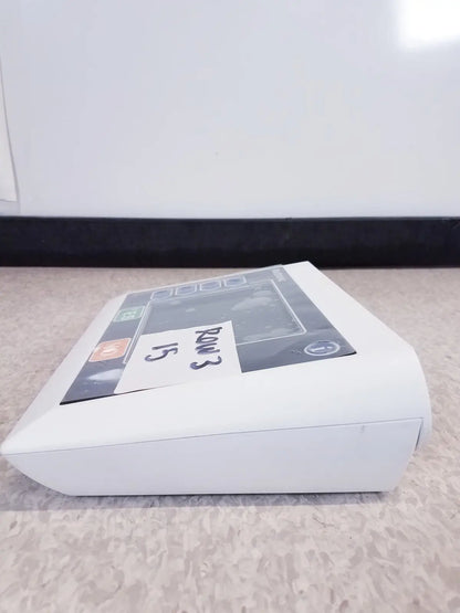 White rectangular electronic device with screen and buttons labeled rm3 15 featuring medtronic commander flex system cd315 untested