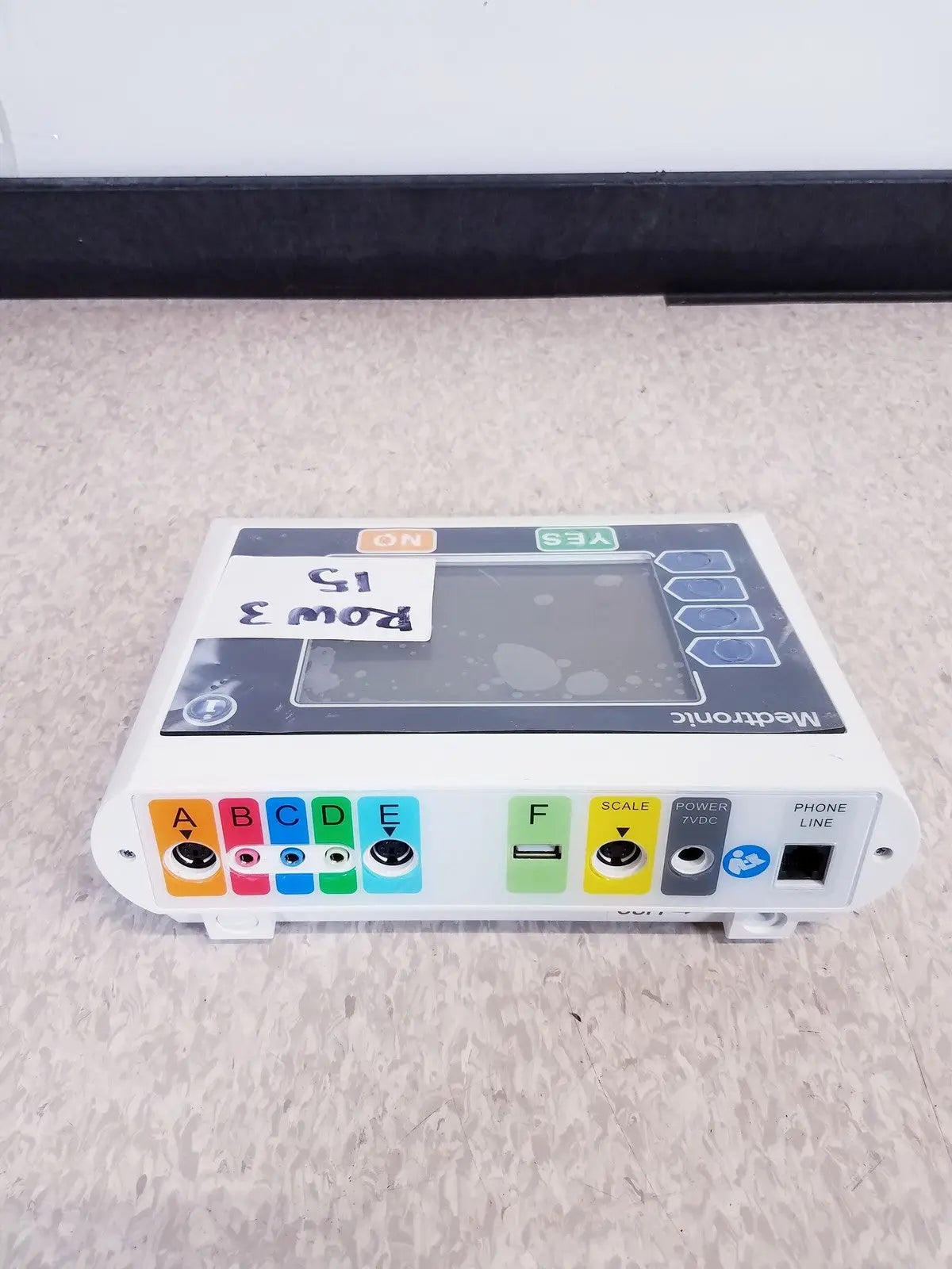 White medtronic commander flex system cd315 with gray touchscreen and colorful labeled ports showing back connectors for reuse medical use