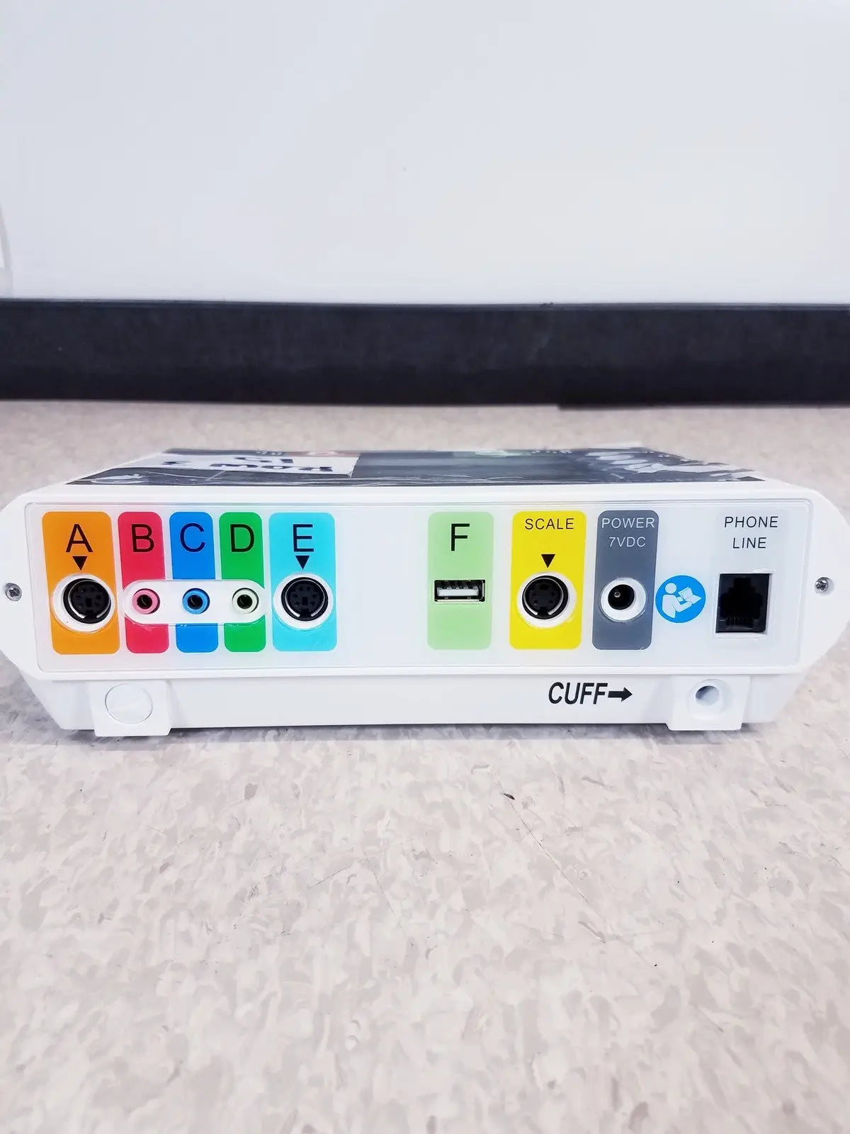 White medtronic commander flex system cd315 medical device with colorful labeled ports usb port and cuff indicator on side