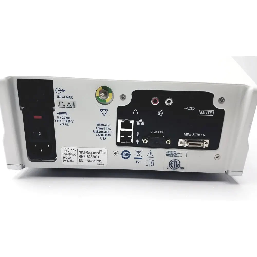 White medtronic nim-response 3.0 reuse medical device with black control panel and multiple ports on back side