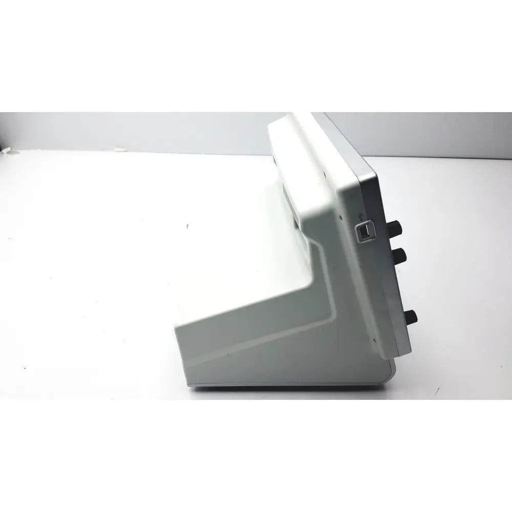Gray plastic Medtronic nim-response 3.0 console with black knobs and USB port for reuse medical applications