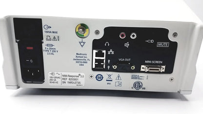 White medtronic nim-response 3.0 reuse medical device with black control panel and multiple ports on back side