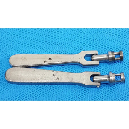 Two silver-toned metal medtronic octobase retractor handles with smooth slightly worn finish lot of 2 surgical components
