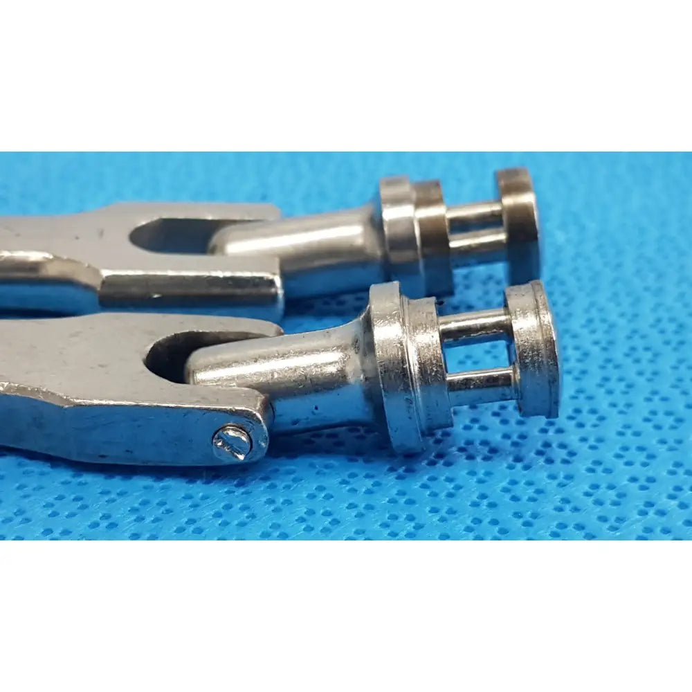 Silver metallic medtronic octobase retractor handle with polished reflective finish and precision-engineered joints lot of 2