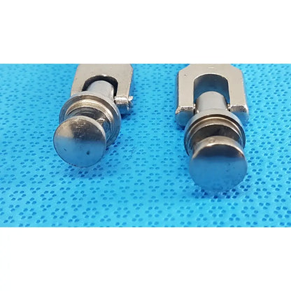 Two metallic u-shaped medtronic octobase retractor handles with silver-toned textured cylindrical ends lot of 2