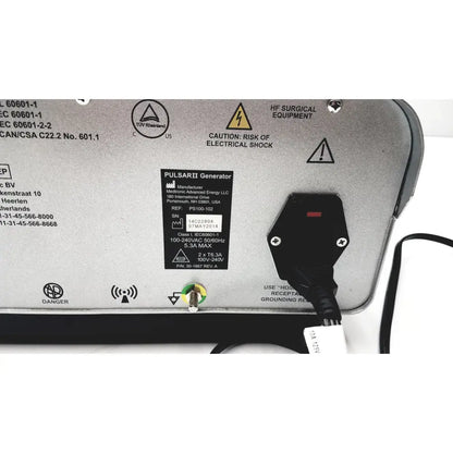 Black power cord plugged into the silver medtronic peak plasmablade pulsar ii generator medical device back side view