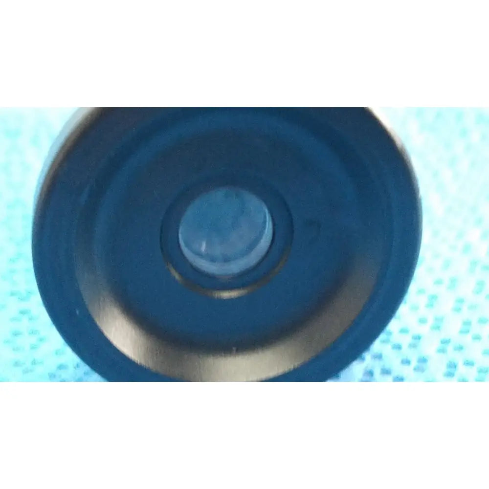 Dark blue circular camera lens with metallic rim and glass element in medtronic sharpsite autoclavable 134°c endoscope
