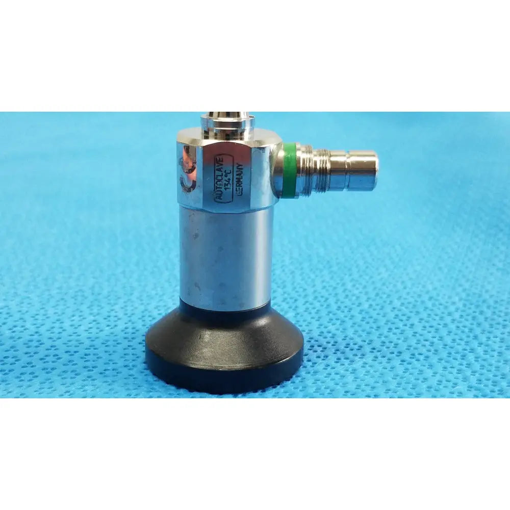 Silver metallic medtronic sharpsite autoclavable 134°c endoscope instrument with black rubber base and green accent ring