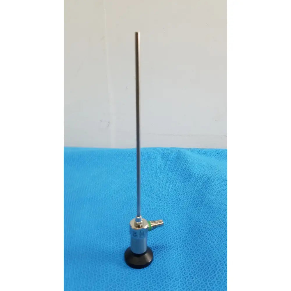 Silver medtronic sharpsite autoclavable 134°c endoscope with slender metallic shaft and black circular base