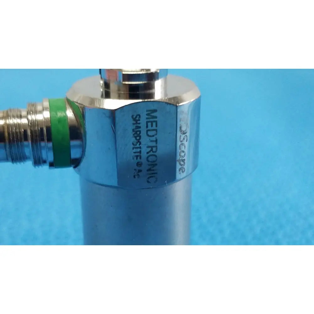 Silver metallic medical-grade medtronic sharpsite valve with green band for autoclavable 134°c endoscope connection