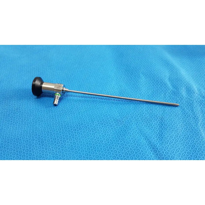 Silver medtronic sharpsite autoclavable 134°c endoscope with black handle and green-tipped connector for surgical use