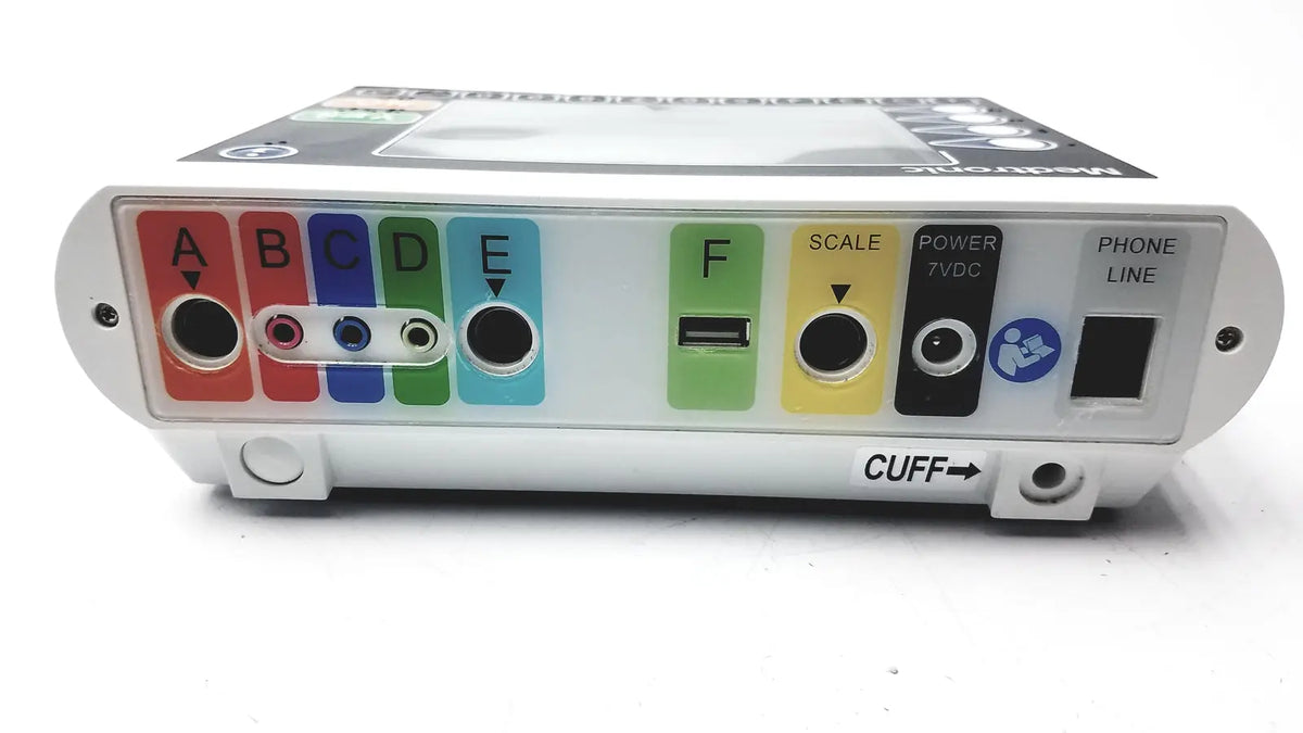 White plastic medical device medtronics commander flex 100011-031 with colorful labeled ports including red blue green yellow and black connectors