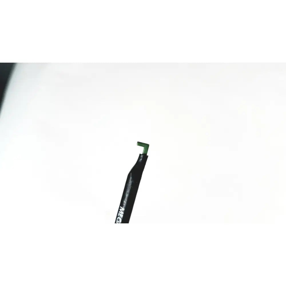 Black pen with green tip and white lettering on barrel of megadyne e-z clean l-hook laparoscopic electrosurgical instrument