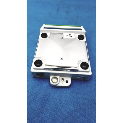 White rectangular mettler bb1200 digital scale with black circular ports and green stripe along the top edge