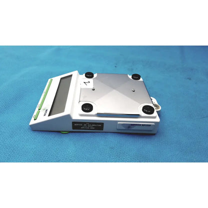 Mettler bb1200 digital scale white and silver with rectangular platform black calibration screws green buttons and display screen