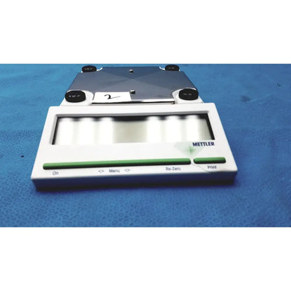 White and green mettler bb1200 digital scale with metallic weighing platform for precise measurements