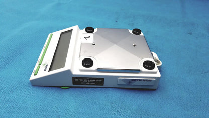 Mettler bb1200 digital scale white and silver with rectangular platform black calibration screws green buttons and display screen