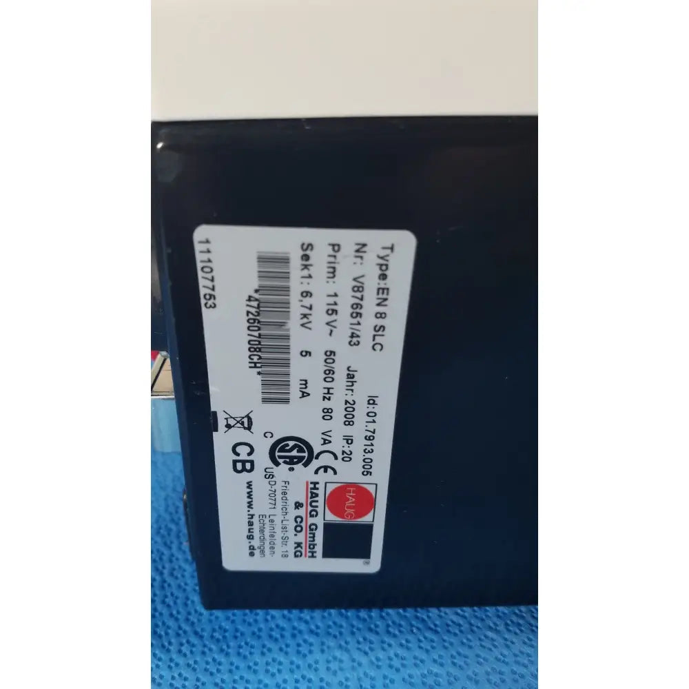 Black rectangular mettler toledo haug slc power supply with white label showing technical specifications on the back side