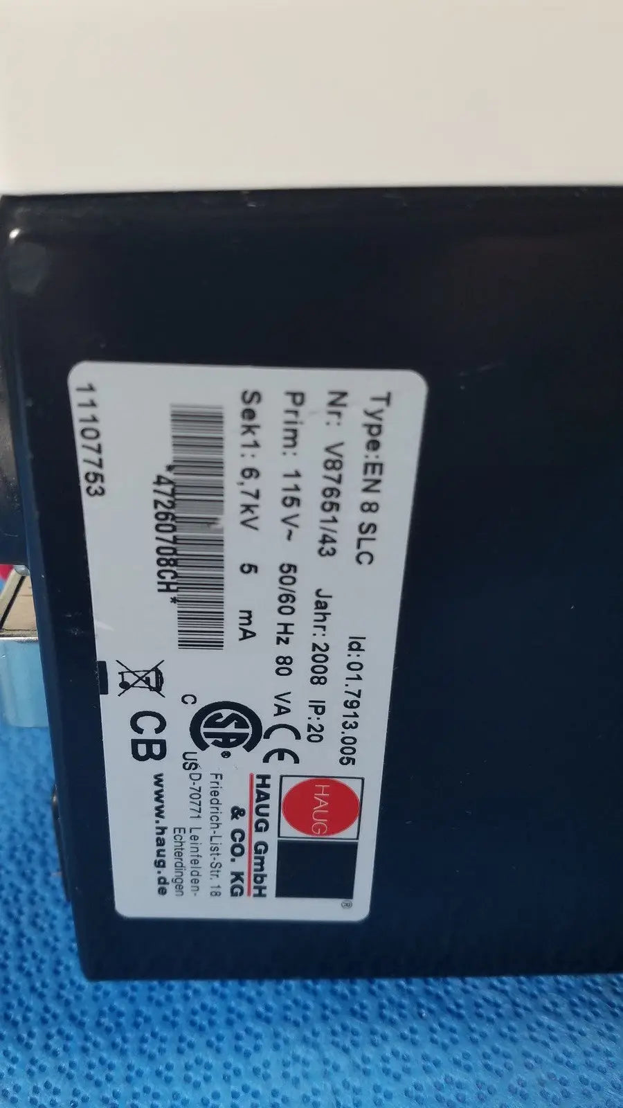 Black rectangular mettler toledo haug slc power supply with white label showing technical specifications on the back side