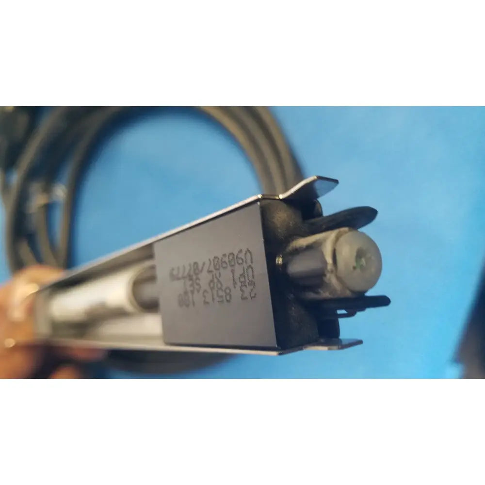 Silver rectangular metal housing with black plastic parts and coiled cable showing engraved serial numbers on mettler toledo haug static eliminator power supply back side