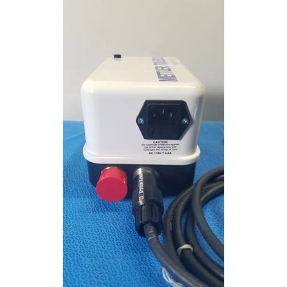 White and black mettler toledo haug static eliminator power supply with red emergency button and coiled black cables back side