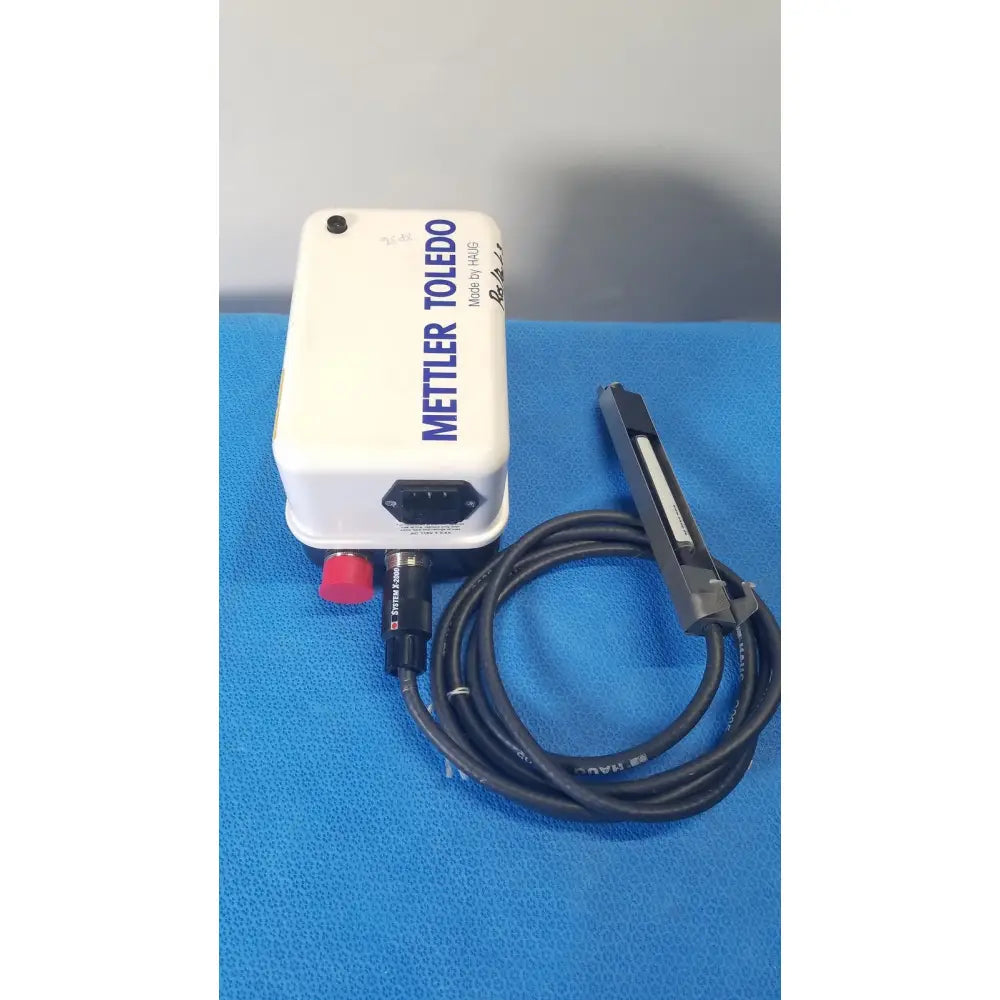White mettler toledo haug static eliminator power supply with red button and black coiled cable for ionizing use