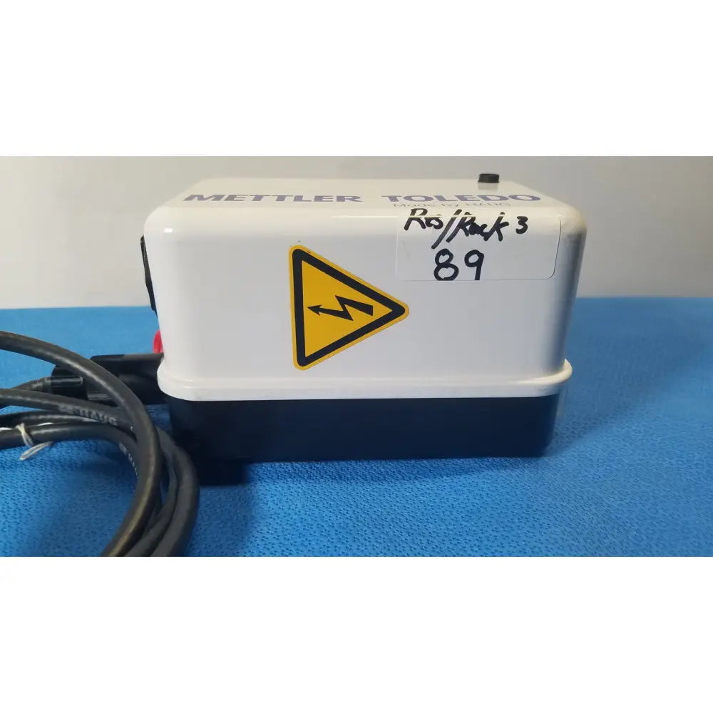 White and navy blue mettler toledo mettler toledo ro back 3 water purifier showing the haug static eliminator bar system ionizing power supply with yellow warning label