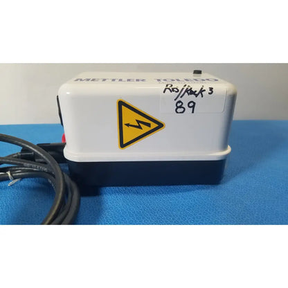 White and navy blue mettler toledo mettler toledo ro back 3 water purifier showing the haug static eliminator bar system ionizing power supply with yellow warning label