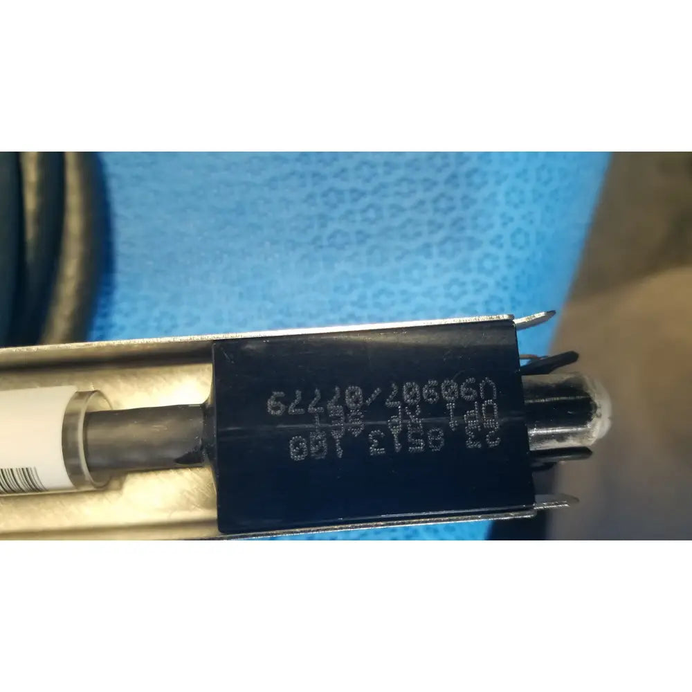 Black rectangular label with white alphanumeric code on mettler toledo haug static eliminator bar ionizing power supply 115v back