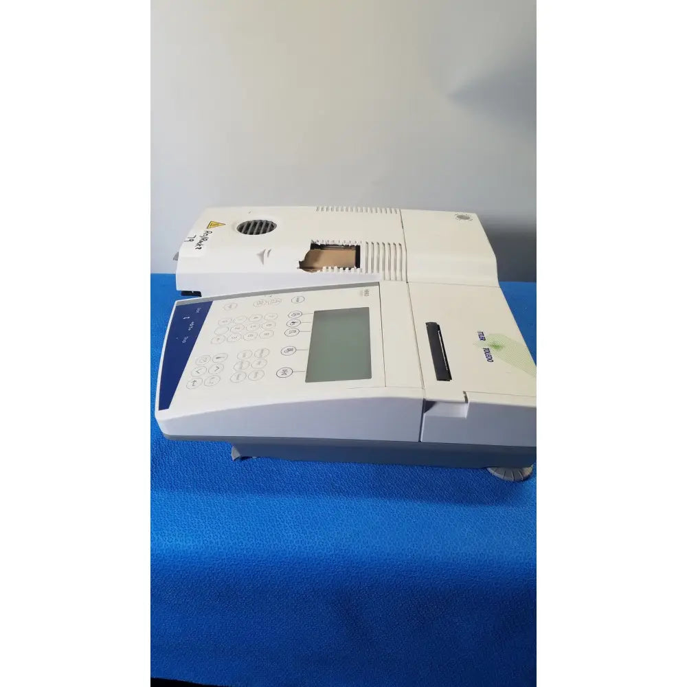 White and gray mettler toledo hr83-p halogen moisture analyzer with digital display keypad and paper output slot