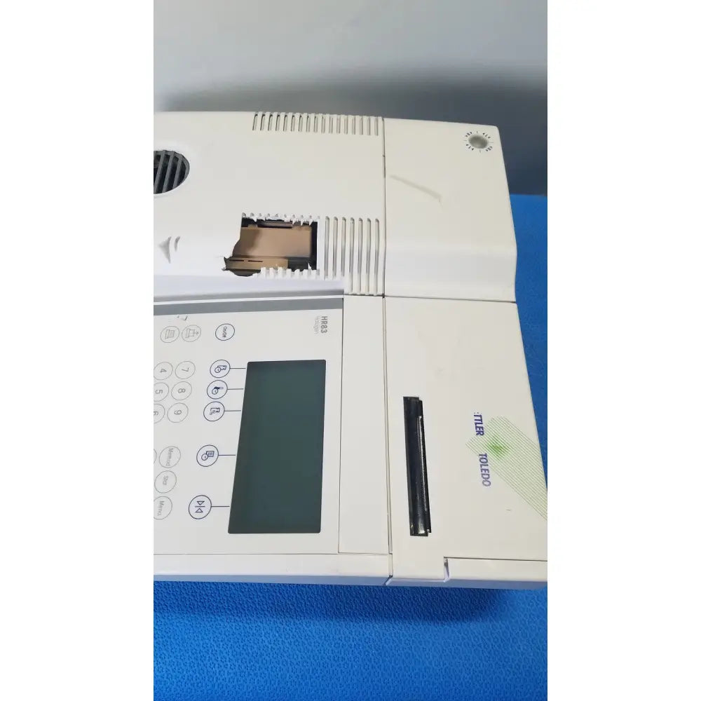 White plastic mettler toledo hr83-p halogen moisture analyzer with digital display keypad and paper tray