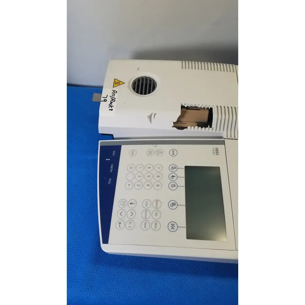 White mettler toledo hr83-p halogen moisture analyzer with digital display and numeric keypad for precise lab measurements