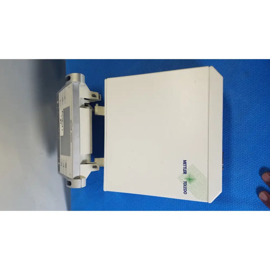 White rectangular mettler toledo umx2 ultra-microbalance scale with metallic side panel and green diagonal stripe logo