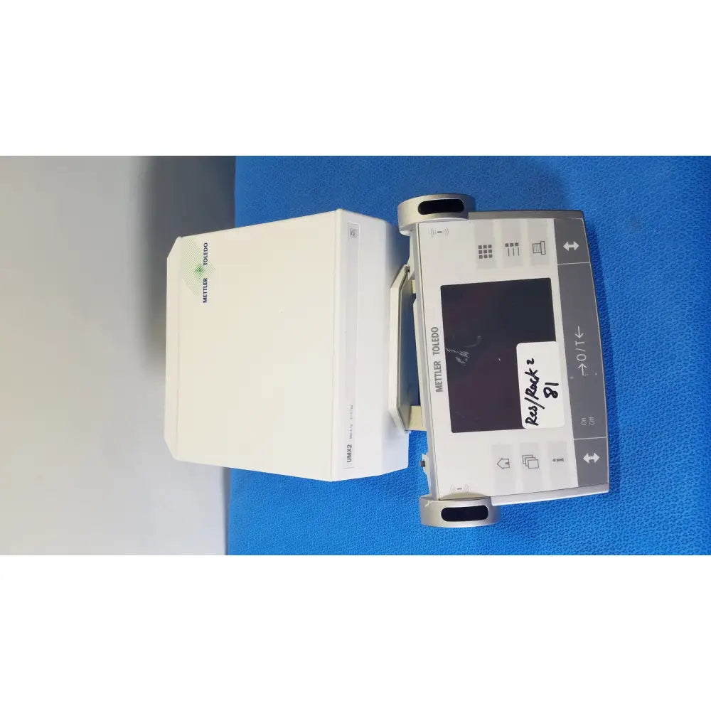 Silver and gray mettler toledo umx2 infusion pump with digital display screen labeled ras/back 81 front panel