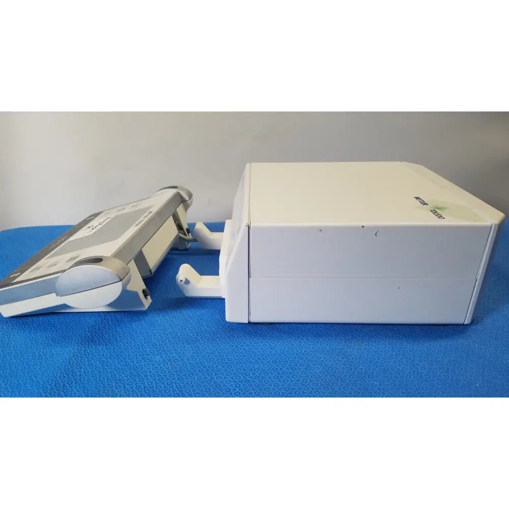White rectangular mettler toledo umx2 ultra-microbalance scale with silver accents and circular side dial